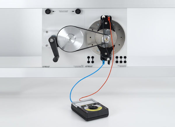 Generating AC voltage using a revolving-field generator and a stationary-field generator